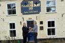 Richard Crabb (left), NWT Estates and Facilities Manager, receives the keys to the pub from John Uff (previous owner) Picture: NWT