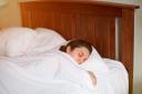 A new study has found that getting plenty of sleep can stave off IBS (Alamy/PA)