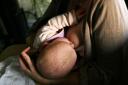 Mothers who breastfeed their children are less likely to give them sugary treats (Katie Collins/PA)