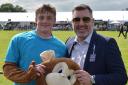 Mark Richardson aka Fast and Furious George the Suffolk New College mascot - with college principal Alan Pease