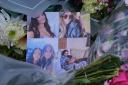 Pictures left on floral tributes at Ashlyn Close, Bushey, Hertfordshire (Jonathan Brady/PA)