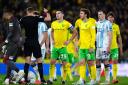 Referee James Bell shows a red card to Norwich City's Kenny McLean during the Sky Bet Championship match at Carrow Road, Norwich. Picture date: Sunday October 27, 2024.