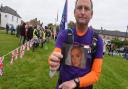 Tim Owen, from Shouldham, with a picture of his daughter Emily, during hisThree Dads Walking campaign