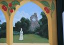 The ghostly figure of nun Sister Barbara by the Abbey ruins features on one of the Marham village signs. Picture: DENISE BRADLEY