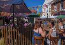 People enjoying Dereham Blues Festival at The Bull pub in July 2022