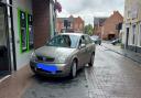 The Vauxhall driver was pulled over outside Lloyds Bank in Fakenham