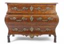 A French Louis XVI walnut veneered Bombe commode chest with an estimate of £1,500-£2,500