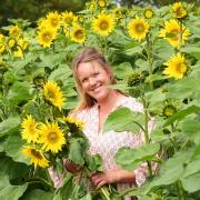 Jo Sindall in the sunflower field at Ha Ha Farm Picture: Denise Bradley
