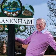 The 'Weasenham whinger' received criticism after posing with the village sign