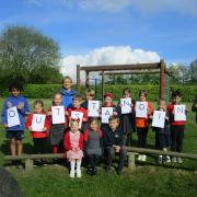 Children from Little Melton Primary School celebrate its outstanding Ofsted rating
