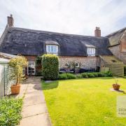 A Grade II listed coastal farmhouse is for sale for £700,000