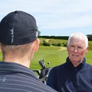 New Mundesley Golf Club chaplain Derek Blois talking to a member