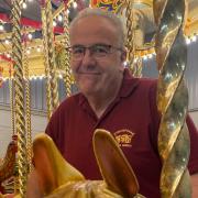 Malcolm Potts on his restored Gallopers carousel at Strumpshaw Steam Museum Picture: Chris Bond