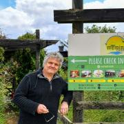 Nigel Marsh at his campsite, with (inset) the controversial toilet block