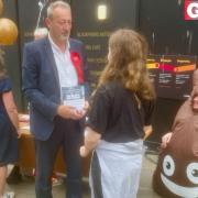 A volunteer dressed as a poo emoji joined Labour's North West Norfolk candidate in King's Lynn