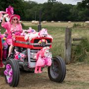 Charity sees pink tractors parade in 20-mile route for a good cause