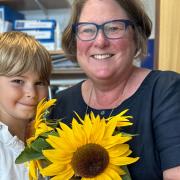 Cassandra Williams, headteacher of Lakenham Primary School, with one of her pupils