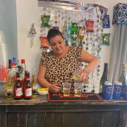 Manager Amanda Jackson serving drinks from the bar at the Mucky Duck at Beccles Care Home. Picture: Black Swan Care Group