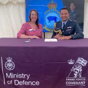Flagship Group’s director of people and workplaces Lisa Collen signs the Armed Forces Covenant alongside Gp Capt Wigglesworth