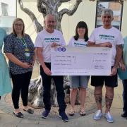 Bullseye! Friends raise £2,400 in darts marathon for cancer care
