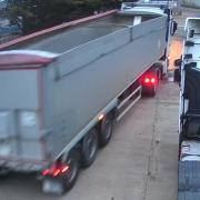 A CCTV screen grab of the silver trailer, left, being driven away from the site by thieves after it was stolen from Lowestoft-based trucking company, Spendlove Transport. Picture: Spendlove Transport