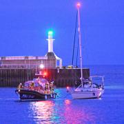 An RNLI crew battled gale force winds to rescue a stranded yacht