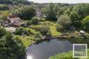 A farmhouse which backs on to the River Wensum has been listed for sale at £1 million