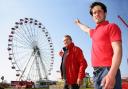 L-R Wayne Marsh and Darren Matthews Jnr in front of the giant observation wheel at Funderworld Picture: Denise Bradley
