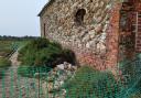 Part of Thornham Harbour has been cordoned off after masonry fell from the Coal Barn