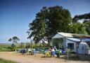 Customers sitting outside the café at Wiveton Hall