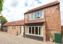 A barn conversion in Potter Heigham has been named the best holiday let in East Anglia