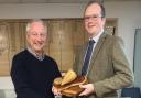 John Lowe (left) receiving Stoke Ferry Agricultural Society's sugar beet prize from Alistair Wright of BBRO