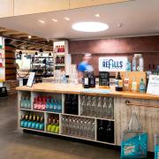 Adnams has introduced refillable beer, wine and gin to four of its high street stores in a drive to continue its sustainable legacy.