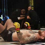 My Fighter of the Year James Webb hits the floor after stopping Jason Radcliffe at Cage Warriors 99 in Colchester. Picture: BRETT KING