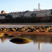 Hunstanton is famed for its white lighthouse perched atop the cliff - but the owner of the former coastguard lookout, not far away, says it's a 