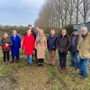 Liz Truss (centre) with villagers at the proposed West Dereham travellers' site