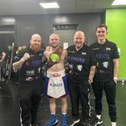 Mike Webber-Kane with his coaching team, from left, Tony Norman, Graham Everett and Joe Everett