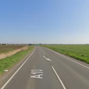 A mini-bus set on fire on the A10 today blocking the road.