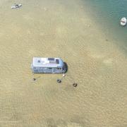 A motorhome surrounded by water at Burnham Overy Staithe harbour Picture: Gary Pearson Photography