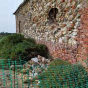 Part of Thornham Harbour has been cordoned off after masonry fell from the Coal Barn