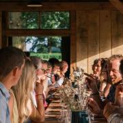 Diners enjoying a meal in The Copse at the Raynham Estate