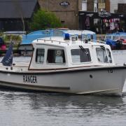 A Broads Authority ranger at the River Bure at Hoveton.