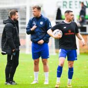 Adam Lakeland, left, coach Josh Coulson and assistant manager Sam Walker plotting another success