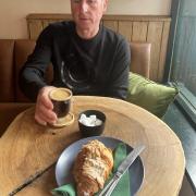 Lloyd Massey enjoying his coffee and almond croissant inside the River Green Pantry, Thorpe St Andrew.