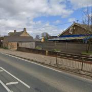 The road outside the former Wormegay Primary School is closed following a crash