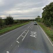 Police remain on scene at a crash on a major road