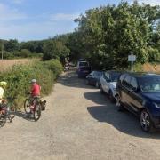 Police were called after a car got stuck on lane leading to beach at Waxham