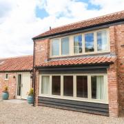 A barn conversion in Potter Heigham has been named the best holiday let in East Anglia