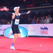 Logan Smith celebrates his new PB on the home straight of the Frankfurt Marathon