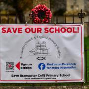 One of the banners which have gone up in Brancaster, in protest at plans to close the village's primary school